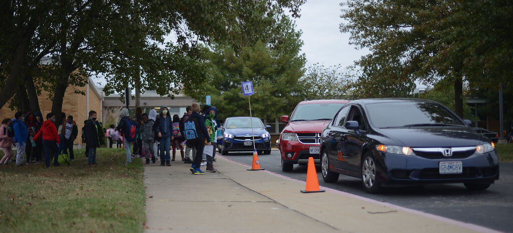 Elementary schoolers wait for pick up at New Haven Elementary School